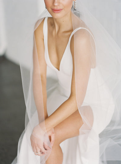 Float down the aisle in our soft English tulle Intermediate veil. 