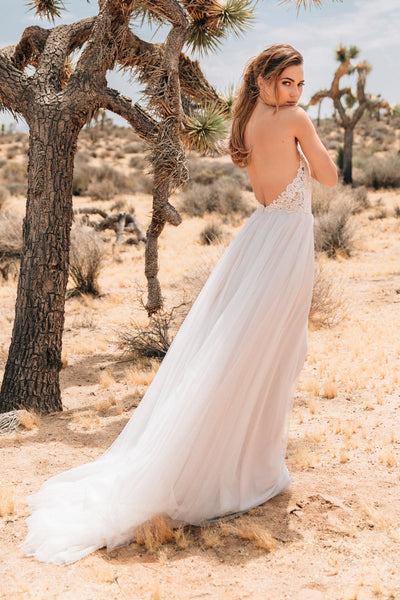 Boho lace wedding dress with anemone embroidered lace and illusion tulle.